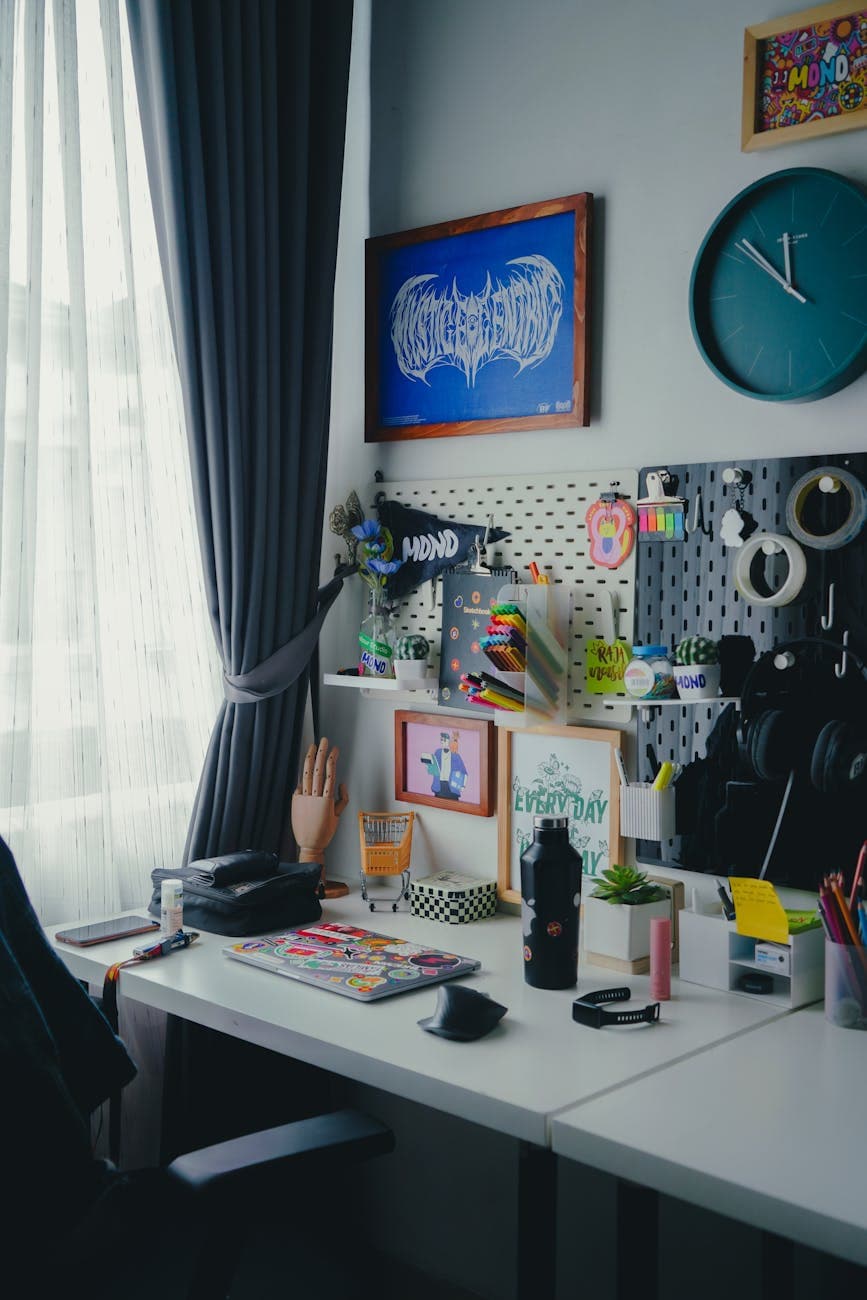 A stylish and organized desk setup with artwork, ideal for productivity and creativity.