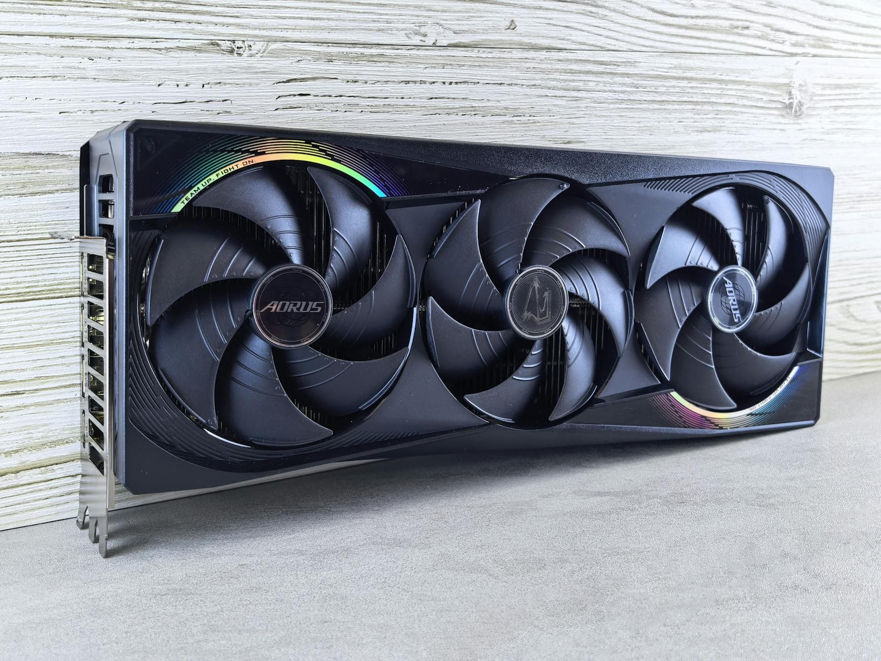 Triple fan GPU with RGB lighting, ideal for gaming setups and high-performance computing.